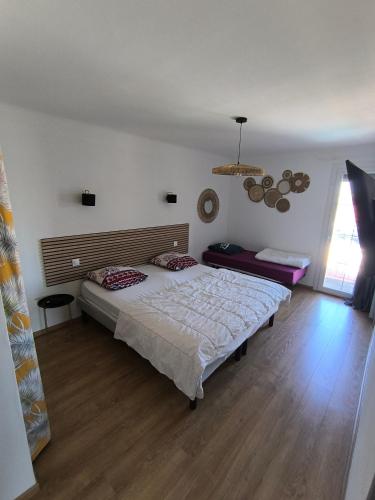 a bedroom with a large bed in a room at Villa Eden in Latour-Bas-Elne
