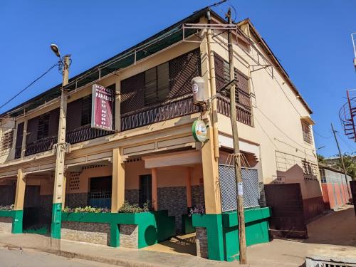 an old building with a green trim at Le Paradis du Nord in Diego Suarez