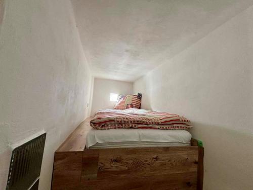 a small bedroom with a bed in a room at Apartmán Pod Hvězdami in Štítary