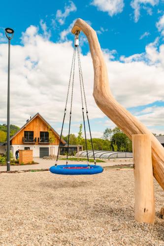 a swing in a playground at Mlýnická Zahrada in Červená Voda