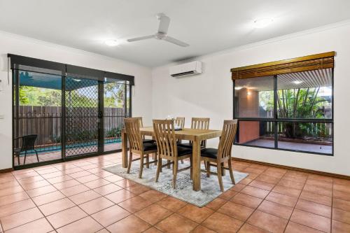 a dining room with a table and chairs at Beach Retreat on Demco in Broome