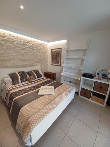 a bedroom with a bed and a staircase in it at T1 Cosy "Clairefont" Terrasse privée vue Loire dans Maison in Aurec-sur-Loire