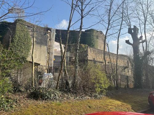 an old building with a castle on top of it at Evasio Suite in Sedan