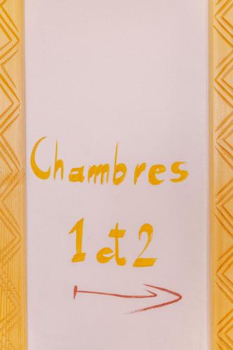 a sign that says chumps on a paper at Tasga Guest House in Tamraght Oufella