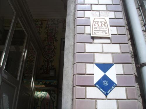 Et logo, certifikat, skilt eller en pris der bliver vist frem på Villa Olga