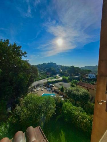 a view of a park with the moon in the sky at Trilocale con piscina in Montescudaio
