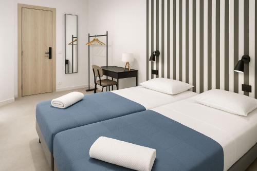 Ένα ή περισσότερα κρεβάτια σε δωμάτιο στο Koala Hostel Estación