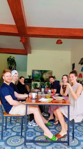 a group of people sitting at a table at Ninh Binh Kong's Homestay in Nguyên Ngoại