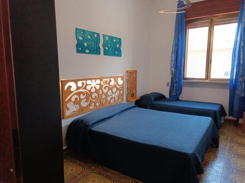 Postel nebo postele na pokoji v ubytování Sul mare casa Bea