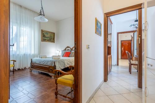 a bedroom with a bed and a room with a mirror at Vintage al passetto - Ancona Centro in Ancona