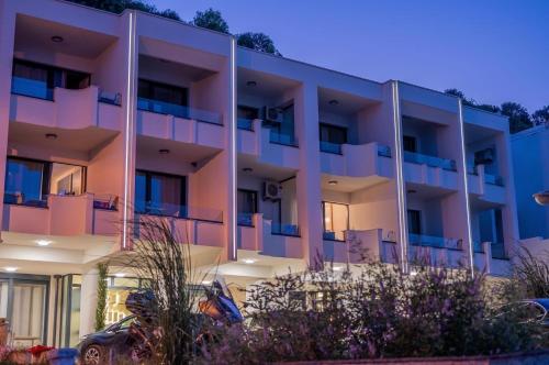 a large apartment building with a lot of balconies at Sea Star Apartments in Ulcinj