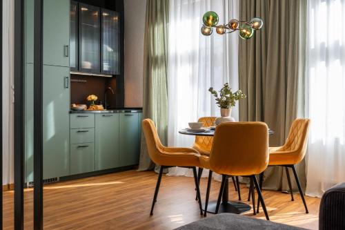 a kitchen and dining room with a table and chairs at Maison & Mood Colditz in Colditz
