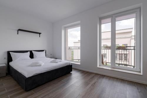 Ένα ή περισσότερα κρεβάτια σε δωμάτιο στο Downtown Skyline Penthouse w Parkview&Jacuzzi