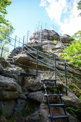 a set of stairs on top of a rocky hill at Penzion Čertovy Kameny in Jeseník