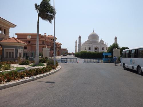 a bus parked on a street in front of a mosque at Porto Sharm Retreat by Mraky Rentals in Sharm El Sheikh