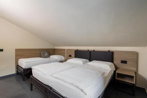 Postel nebo postele na pokoji v ubytování Hotel Loredana