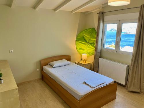 Postel nebo postele na pokoji v ubytování Villa Anemos