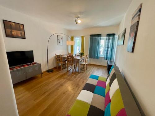 a living room with a couch and a dining room at Aurelia in Sulzbach-Rosenberg