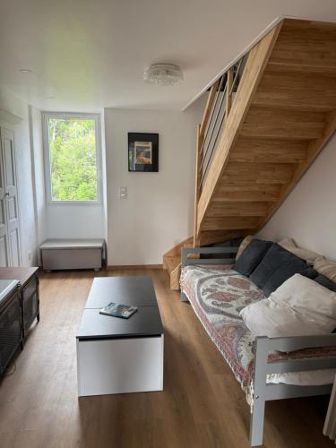 a living room with a couch and a staircase at Casa Tassinca in Tasso