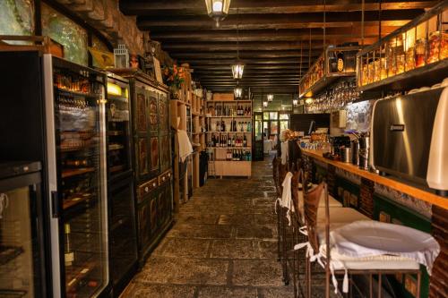 a room with a bar with tables and chairs at Boutique Hotel Las Islas in Fuengirola