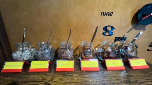 a group of jars of food sitting on a table at Landhotel Weisses Ross garni in Bad Brückenau