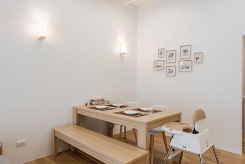 a room with a wooden table and two chairs at The Urban478 Modern&Cozy Stay in Bangkok