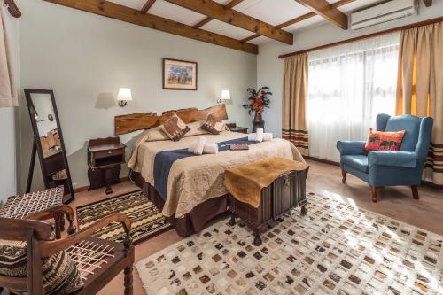 En eller flere senge i et værelse på Dungbeetle River Lodge