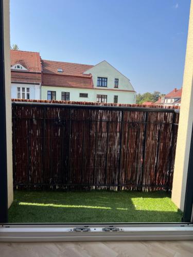 a view of a fence from a balcony at Apartament EROS II in Bolesławiec