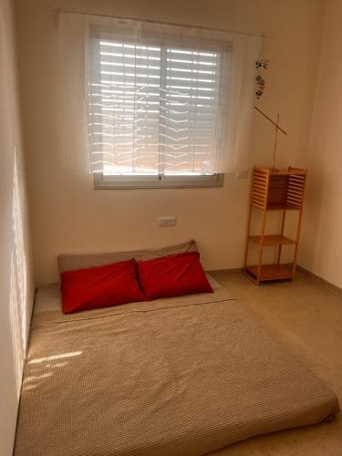 Postel nebo postele na pokoji v ubytování הבית של טלי