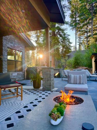 a patio with a fire pit in the middle at Violet Retreat in McCall
