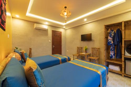 TV a/nebo společenská místnost v ubytování Calm House 4 Hoi An
