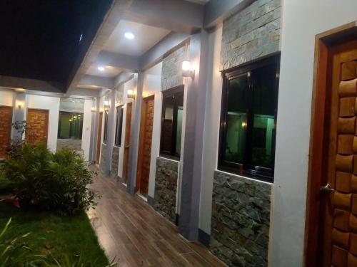 a hallway of a house at night at Lalies Inn in Batuan