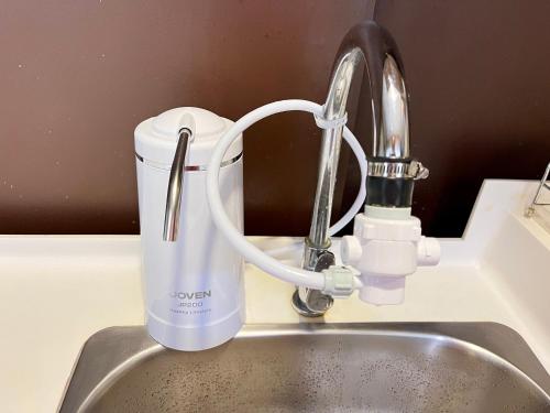 a mixer sitting on a kitchen counter next to a sink at Serene Trefoil Home - Walk to Setia City Mall & Setia City Convention Centre in Shah Alam