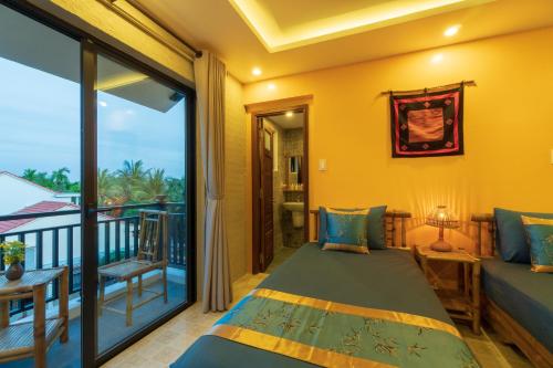Postel nebo postele na pokoji v ubytování Calm House 4 Hoi An