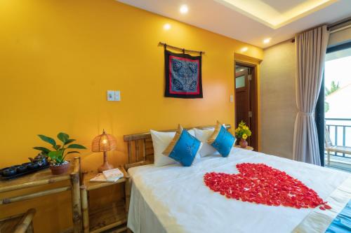 Postel nebo postele na pokoji v ubytování Calm House 4 Hoi An