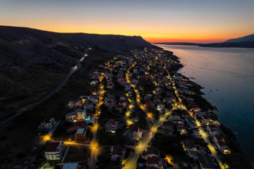 an aerial view of a town on a hill near the water at Babic Apartments in Pag