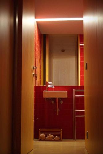 a bathroom with a sink and a mirror at Melgaço Alvarinho Houses in Melgaço