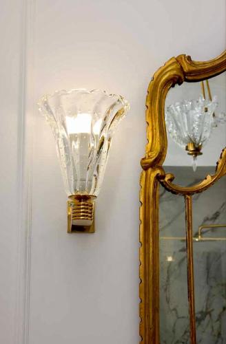 a mirror and a glass lamp next to a mirror at LEtoile du Lac in Blevio