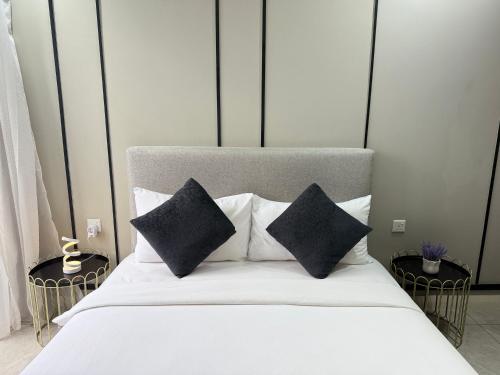Ένα ή περισσότερα κρεβάτια σε δωμάτιο στο Axon Residence Bukit Bintang by TaheeenS