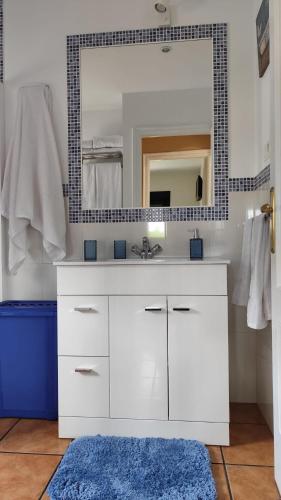 a bathroom with a white sink and a mirror at A Devesa in Noya