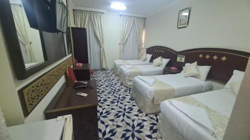 Postel nebo postele na pokoji v ubytování فندق برج صلاح