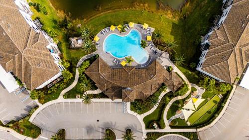 an overhead view of a pool at a resort at Fort Myers 2BR Condo Pool BBQ Area in Estero