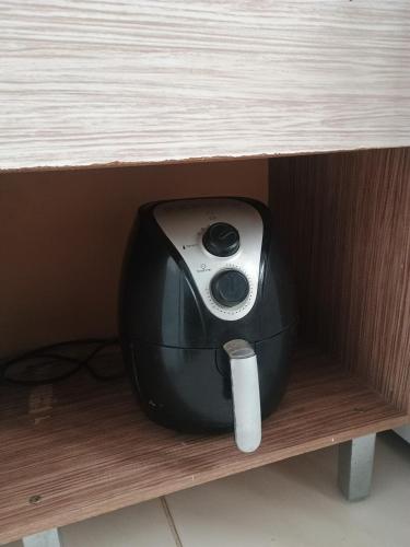 a camera sitting on the shelf of a desk at La Bela Casa in Catanduva