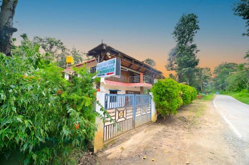 a house on the side of a road at Elephant path Coorg villas in Suntikoppa