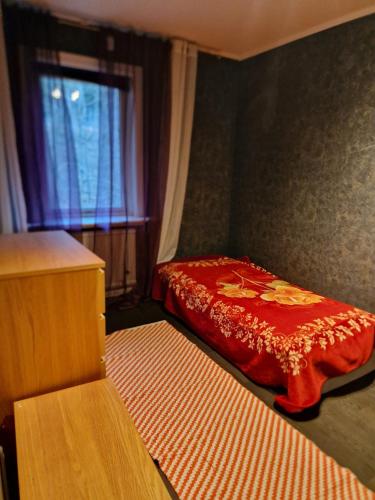 a small room with a bed and a window at Peaceful villa in nature with own beach in Hindås