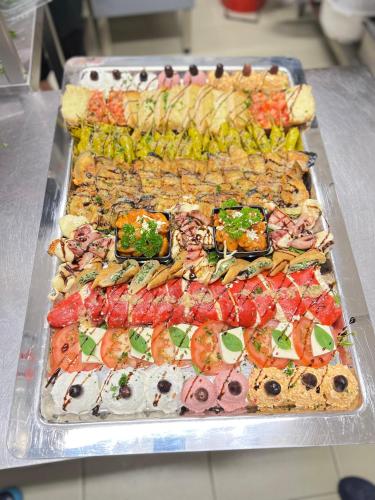 a buffet of different types of food on a table at Hotel &Restaurant Meteora in Glauchau