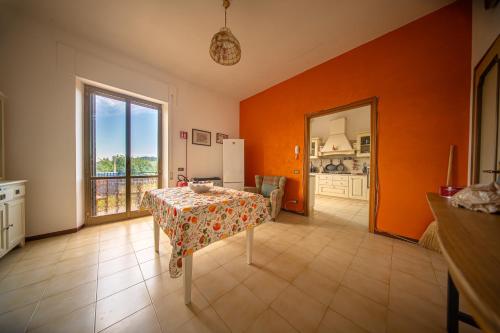 a dining room with a table and a kitchen at Cozy Room with Terrace, Ping Pong & Billiard Table in Monte Molino