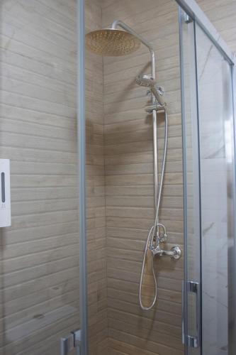 a shower with a glass door in a bathroom at Apartamento Jumar Costa del Sol in Torre del Mar