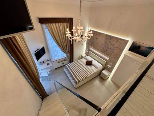 an overhead view of a living room with a chandelier at Le Suite del Duomo in Cava deʼ Tirreni