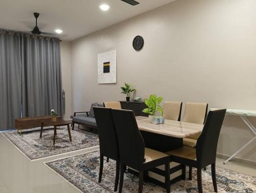 a dining room with a table and chairs at Ssri Homestay Temerloh in Temerloh